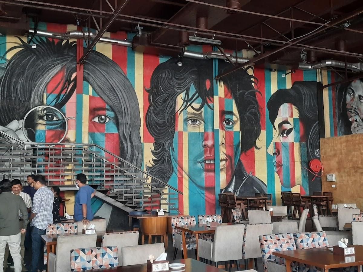 Floor-to-ceiling mural of music legends